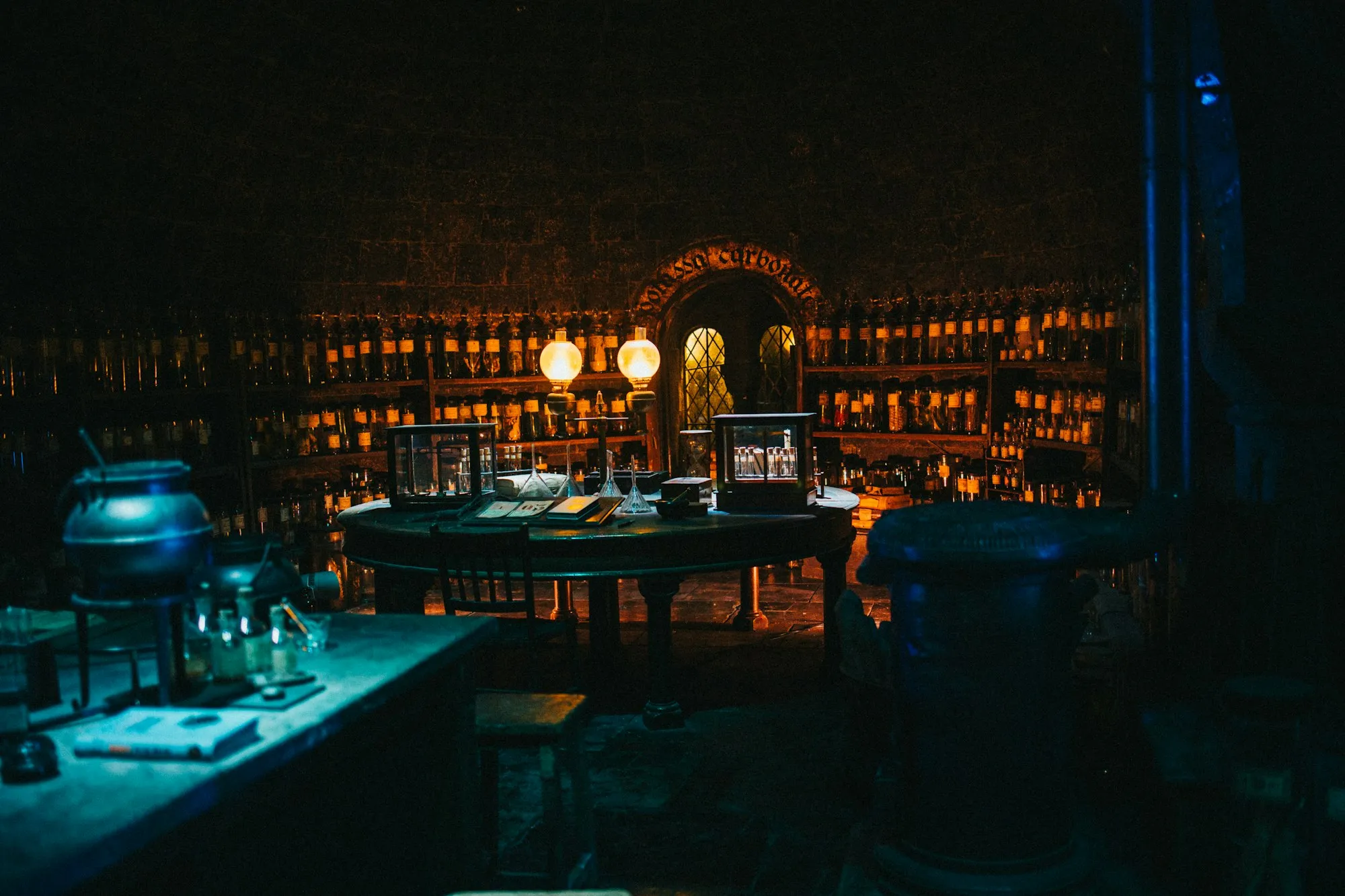 Shelves of glowing potion bottles in the Potions Classroom set