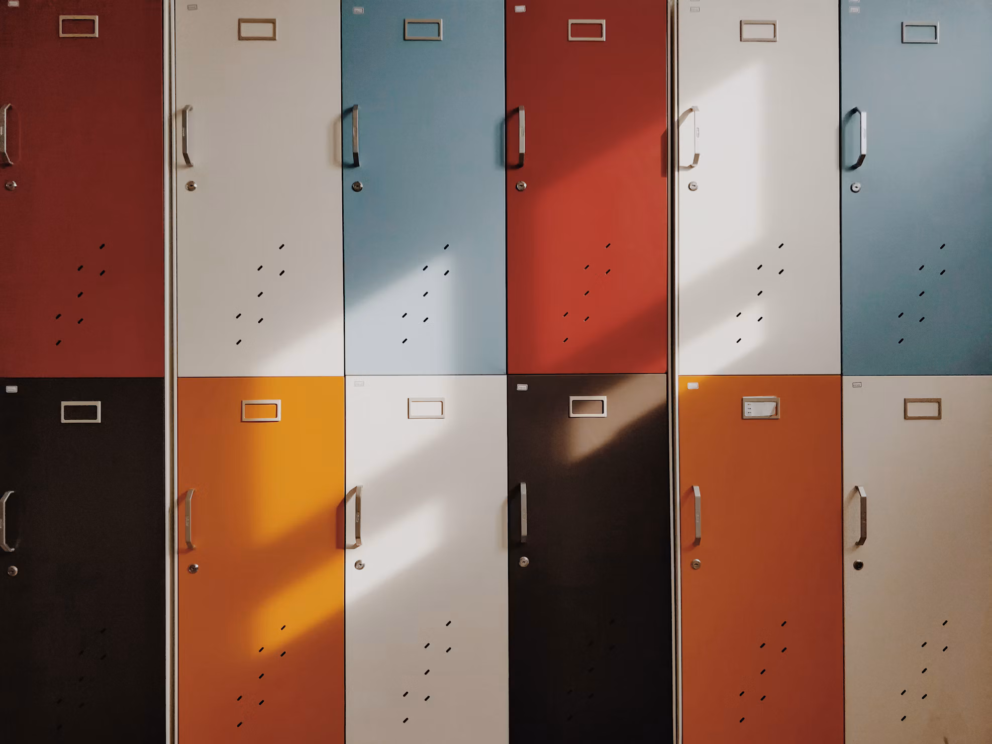Rows of colourful luggage lockers