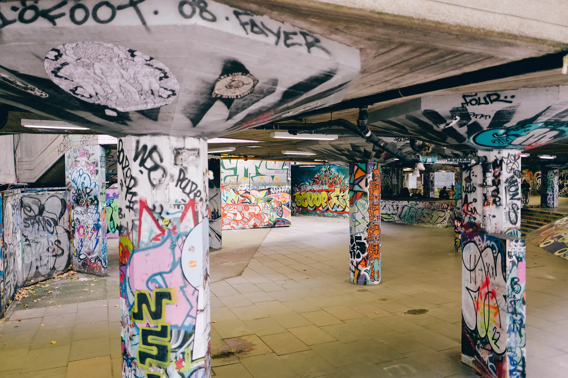 Graffiti-covered concrete pillars and ramps in Southbank Undercroft